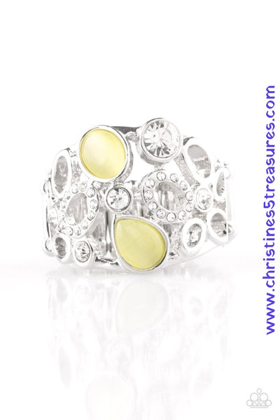 Shimmery silver frames, glassy white rhinestones, and glowing yellow moonstones coalesce across the finger, creating a bubbly frame. Features a stretchy band for a flexible fit. Sold as one individual ring.  P4RE-YWXX-034XX