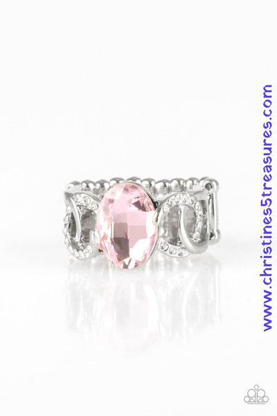 White rhinestone encrusted frames and shiny silver frames link across the finger, coalescing into an airy band. A glittery pink rhinestone is pressed into the center of the band for a glamorous finish. Features a stretchy band for a flexible fit. Sold as one individual ring.  P4RE-PKXX-179XX