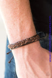 Distressed leather laces braid across the front of a brown leather band for a rugged look. Features an adjustable sliding knot closure. Sold as one individual bracelet.  P9UR-BNXX-217XX