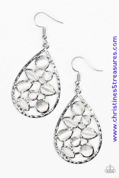 Varying in shape, glassy white moonstones are sprinkled across the center of a silver teardrop, creating a whimsical lure. Earring attaches to a standard fishhook fitting. Sold as one pair of earrings. P5RE-WTXX-302XX