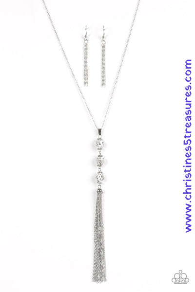 Infused with dainty silver accents, a trio of white beads encrusted in white rhinestones trickle down the chest, creating a sassy pendant. Features an adjustable clasp closure. Sold as one individual necklace. Includes one pair of matching earrings.  P2RE-WTXX-264XX