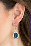A blue gem is pressed into the center of a silver frame radiating with glittery white rhinestones for a glamorous look. Earring attaches to a standard fishhook fitting. Sold as one pair of earrings.   P5RE-BLXX-094XX