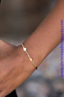 Flat gold hearts link around the wrist, creating a casually dainty palette. Features an adjustable clasp closure. Sold as one individual bracelet.  Get The Complete Look! Necklace: “Fierce Hearts - Gold” (Sold Separately)  P9DA-GDXX-126NG