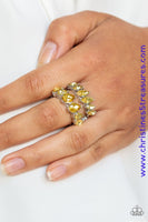Increasing in size near the center, a row of yellow marquise style rhinestones stacks above a row of yellow teardrop rhinestones for a timelessly stacked look. Features a stretchy band for a flexible fit. Sold as one individual ring.  P4RE-YWXX-051XX