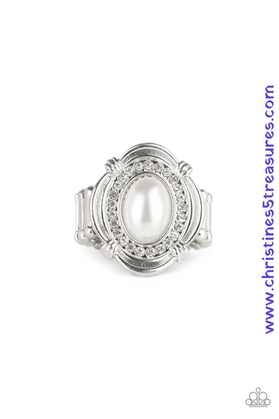 A pearly white bead is pressed into an ornate silver frame radiating with a ring of glassy white rhinestones, creating a timeless centerpiece atop the finger. Features a stretchy band for a flexible fit. Sold as one individual ring.  P4RE-WTXX-357XX