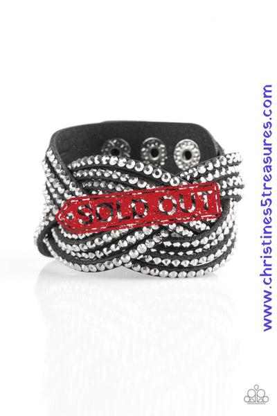 Oversized glassy white rhinestones are encrusted along strands of crisscrossing black suede, creating a fierce shimmer around the wrist. Features an adjustable snap closure. Sold as one individual bracelet.  P9DI-URBK-114XX