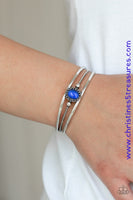 Smooth silver bars flank a textured silver band, coalescing into a layered cuff. A glowing blue cat's eye stone is pressed into the center of the cuff for a whimsical finish. Featured inside The Preview at ONE Life! Sold as one individual bracelet.  P9WH-BLXX-215XX