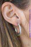 Encrusted in dazzling white rhinestones, a studded silver hoop swings from the ear for a glamorous look. Earring attaches to a standard post fitting. Hoop measures 1" in diameter. Sold as one pair of hoop earrings. P5HO-WTXX-041XX