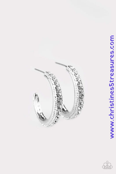Encrusted in dazzling white rhinestones, a studded silver hoop swings from the ear for a glamorous look. Earring attaches to a standard post fitting. Hoop measures 1" in diameter. Sold as one pair of hoop earrings. P5HO-WTXX-041XX