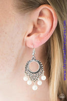 Brushed in an antiqued shimmer, silver filigree climbs a round frame. Pearly white beads swing from the bottom of the decorative lure, creating a whimsical fringe. Earring attaches to a standard fishhook fitting. Sold as one pair of earrings. P5RE-WTXX-251XX