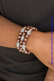 Pinched between white rhinestone encrusted frames, white rhinestone encrusted rings, crystal-beads, and brown pearls are threaded along elastic stretchy bands for a glamorous look. Sold as one individual bracelet.  P9RE-BNXX-092XX