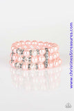 Pinched between white rhinestone encrusted frames, white rhinestone encrusted rings, crystal-beads, and pink pearls are threaded along elastic stretchy bands for a glamorous look. Sold as one individual bracelet.  P9RE-PKXX-128XX