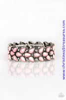 Faceted pink teardrop beads and shimmery silver studs coalesce into ornate frames. The whimsical frames are threaded along stretchy bands around the wrist for a seasonal look. Sold as one individual bracelet.  P9WH-PKXX-215XX