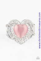 Chiseled into a charming heart shape, a glowing pink cat's eye stone is pressed into the center of two silver heart frames radiating with glassy white rhinestones, creating a romantic centerpiece atop the finger. Features a stretchy band for a flexible fit. Sold as one individual ring.  P4RE-PKXX-208XX