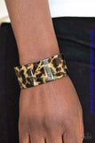 Featuring cheetah-like print, a thick acrylic cuff wraps around the wrist for a retro inspired look. Sold as one individual bracelet.  P9ST-BNXX-002XX