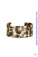 Featuring cheetah-like print, a thick acrylic cuff wraps around the wrist for a retro inspired look. Sold as one individual bracelet.  P9ST-BNXX-002XX
